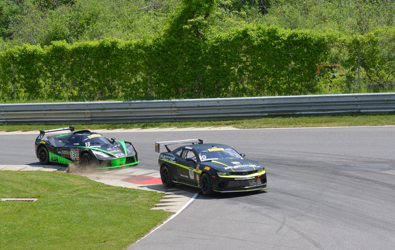 Lawson Aschenbach’s Black dog Speedshop Chevrolet Camaro Z28 leads Brett Sandburg’s ANSA Motorsports KTM X-Bow GT4